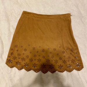 Lightly used Faux suede flower cutout skirt.